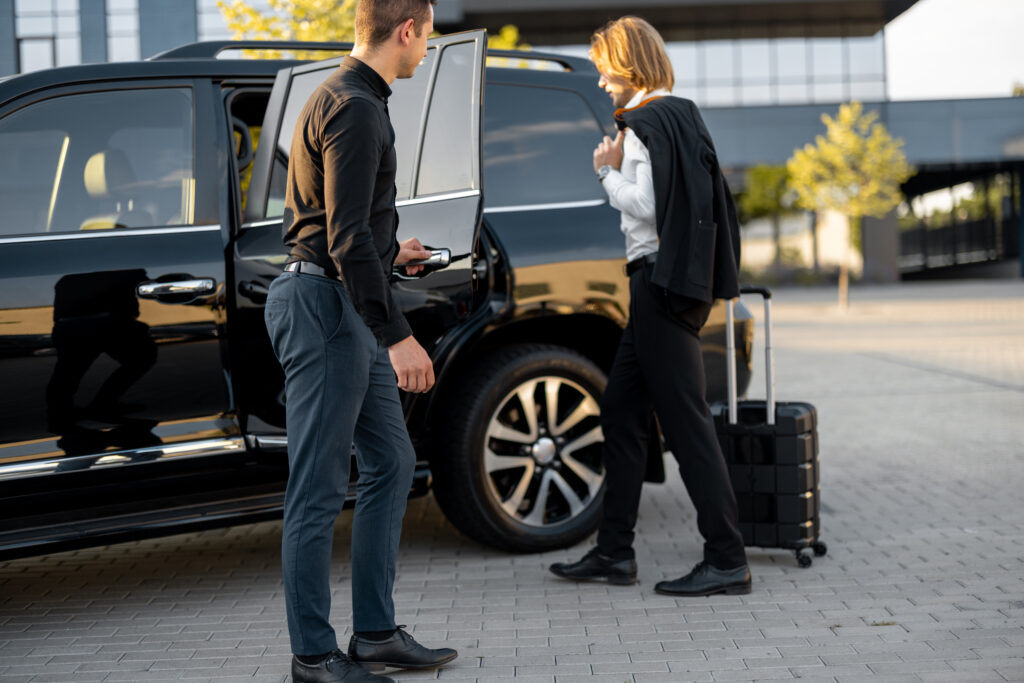 Man and woman having a business trip, traveling by car